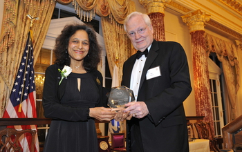 Nadkarni receives the National Science Board Public Service Award from then NSB Chairman.